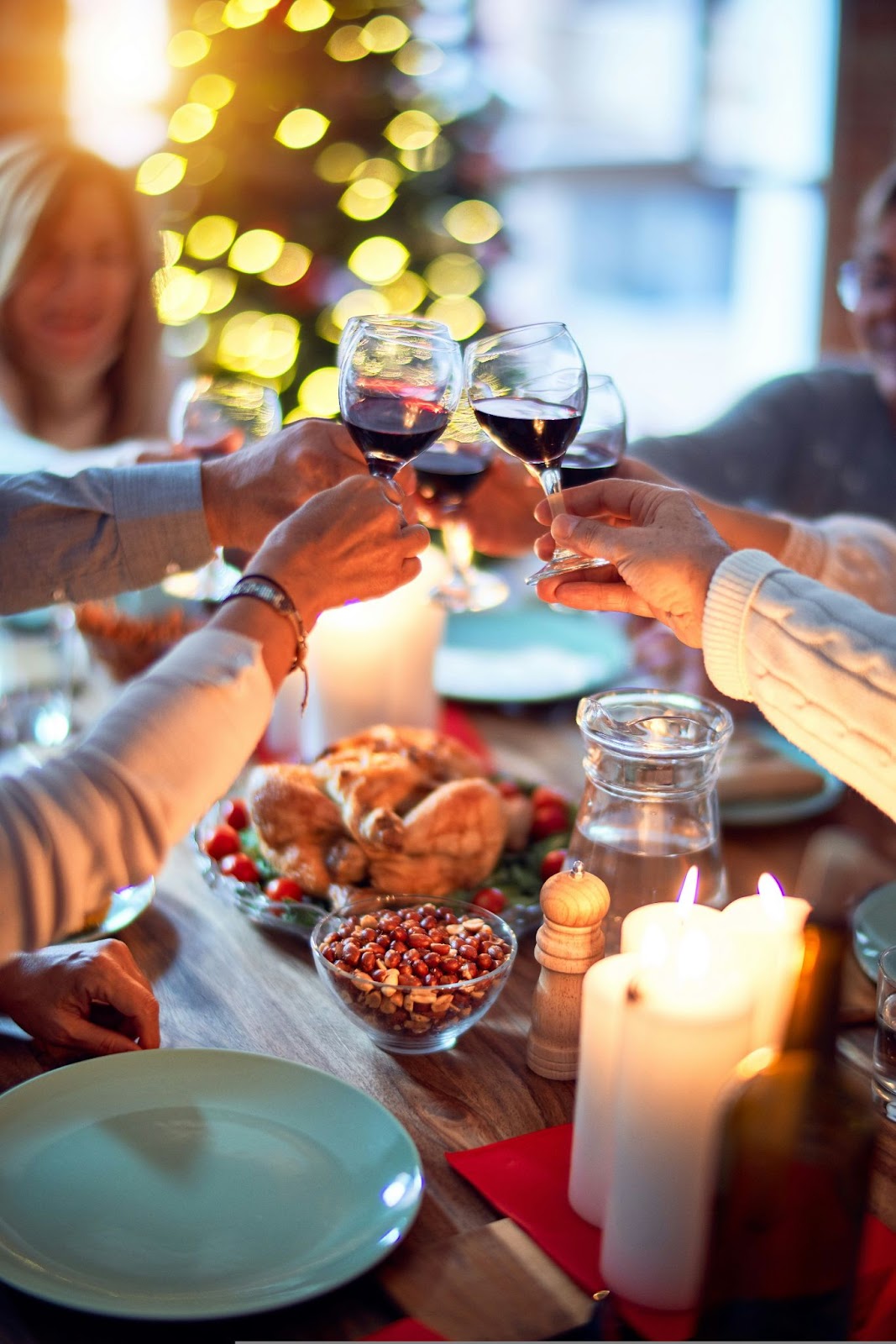 a family toasts during a christmas dinner